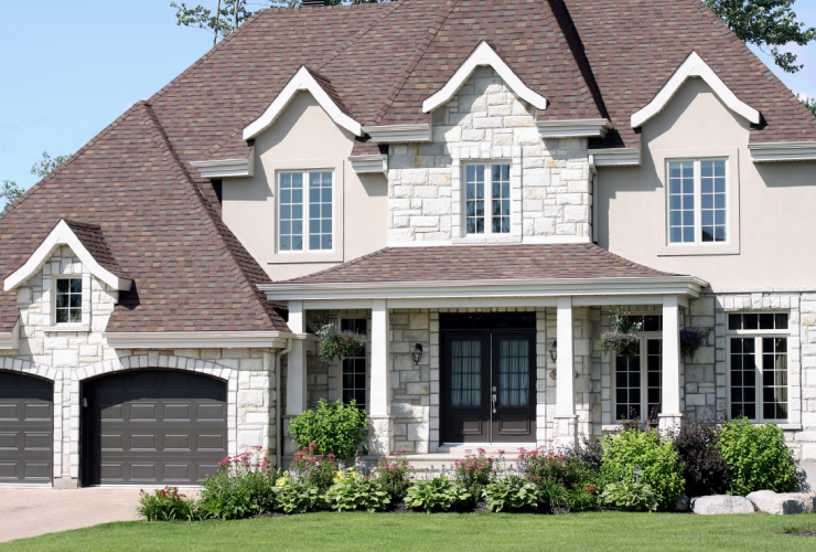 A large house with a lot of windows and doors.