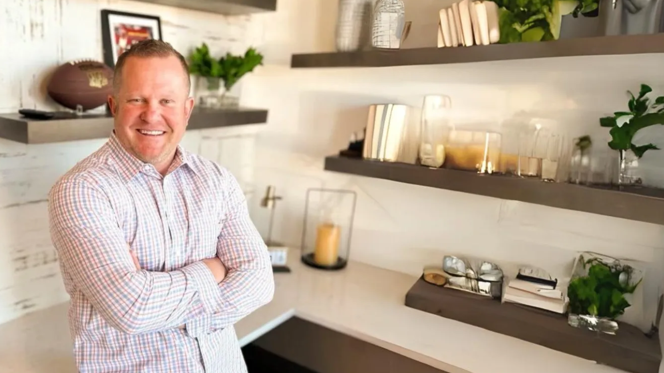 A man standing in front of some shelves